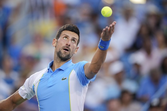 Novak Djokovic, of Serbia, serves to Carlos Alcaraz, of Spain, during the men&#039;s singles final of the Western &amp; Southern Open tennis tournament, Sunday, Aug. 20, 2023, in Mason, Ohio. (AP Phot ...