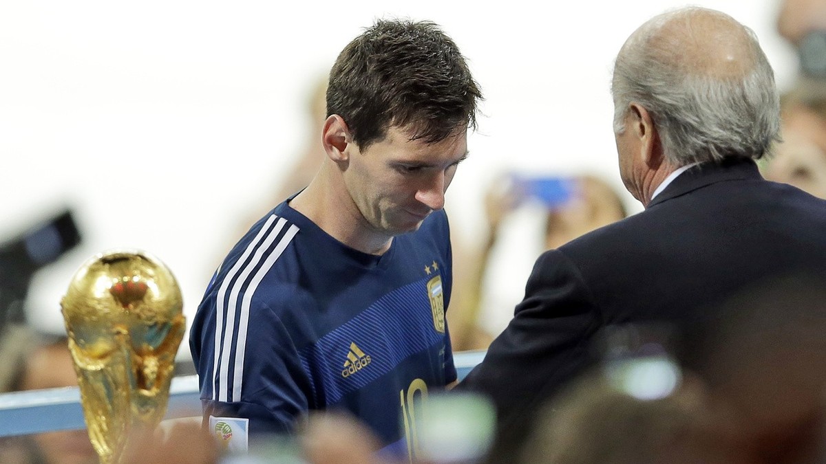 Argentina's Lionel Messi collects the second place trophy after the World Cup final soccer match between Germany and Argentina at the Maracana Stadium in Rio de Janeiro, Brazil, Sunday, July 13,  ...