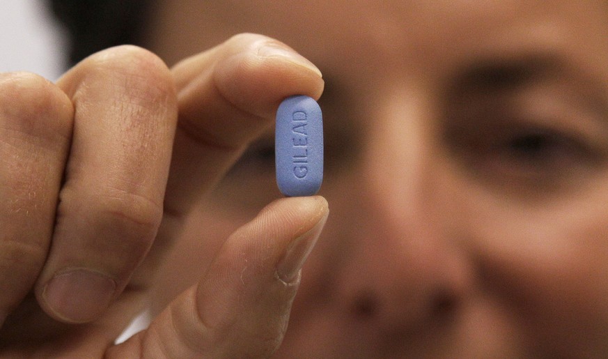 FILE - In this May 10, 2012 file photo, Dr. Lisa Sterman holds up a Truvada pill, an HIV treatment pill used to prevent infection in people at high risk of getting the AIDS virus, at her office in San ...