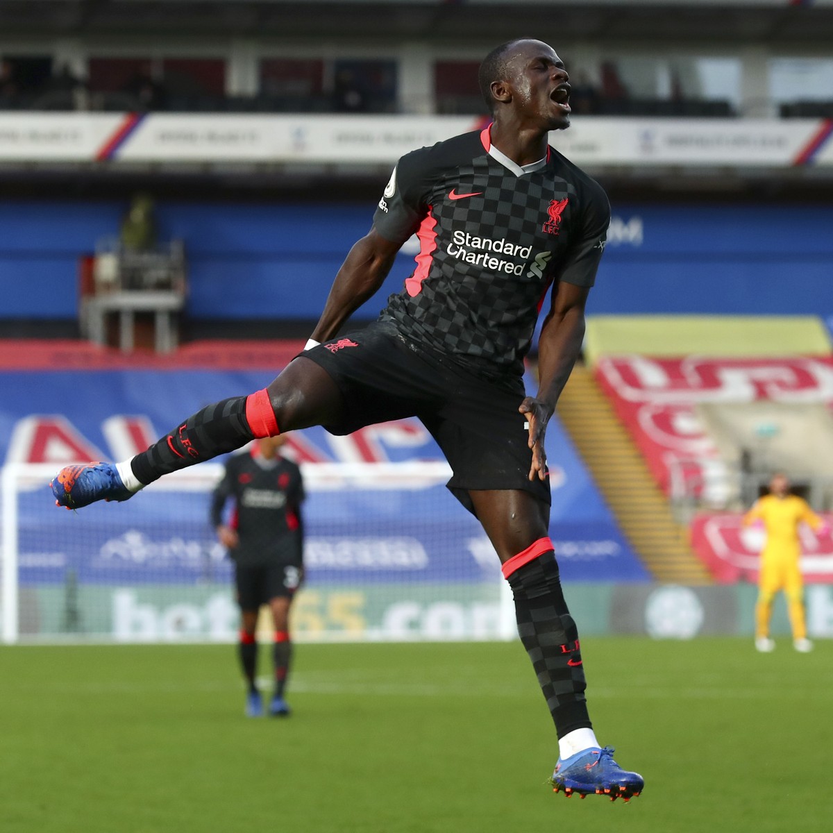 Liverpool's Sadio Mane celebrates after scoring his side's second goal during the English Premier League soccer match between Crystal Palace and Liverpool at Selhurst Park stadium in London, ...