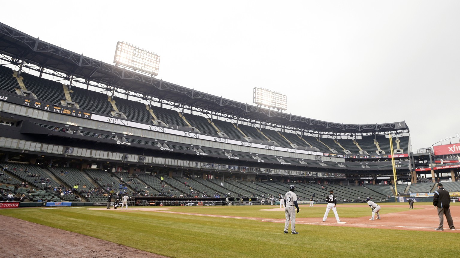 The stands are sparsely filled in temperatures below 40 degrees as the Chicago White Sox play against the Tampa Bay Rays at Guaranteed Rate Field during a baseball game in Chicago, Monday, April 9, 20 ...