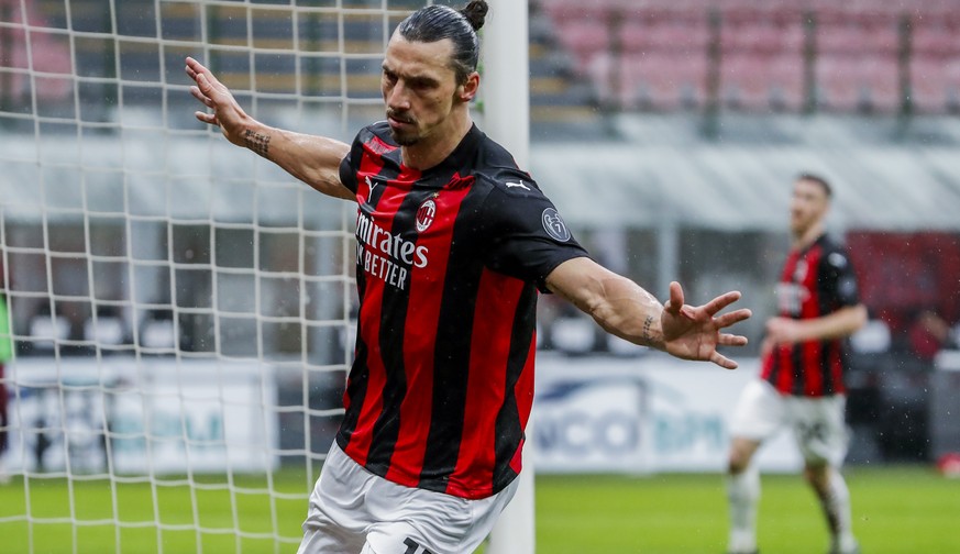 AC Milan&#039;s Zlatan Ibrahimovic celebrates after scoring the opening goal during the Serie A soccer match between AC Milan and Crotone at the San Siro stadium in Milan, Italy, Sunday, Feb. 7, 2021. ...
