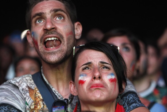 Supporters of France react during the Euro 2016 final soccer match between Portugal and France, Sunday, July 10, 2016 in the fan zone of Marseille, southern France. (AP Photo/Claude Paris)