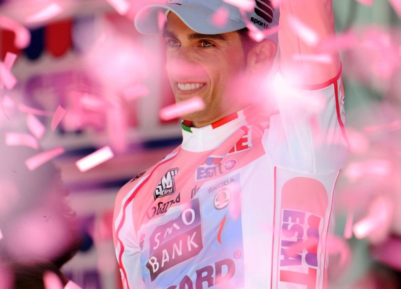 Spain&#039;s Alberto Contador celebrates on the podium after winning the 94th edition of the Giro d&#039;Italia, Tour of Italy cycling race, in Milan, Sunday, May 29, 2011. Contador secured his second ...