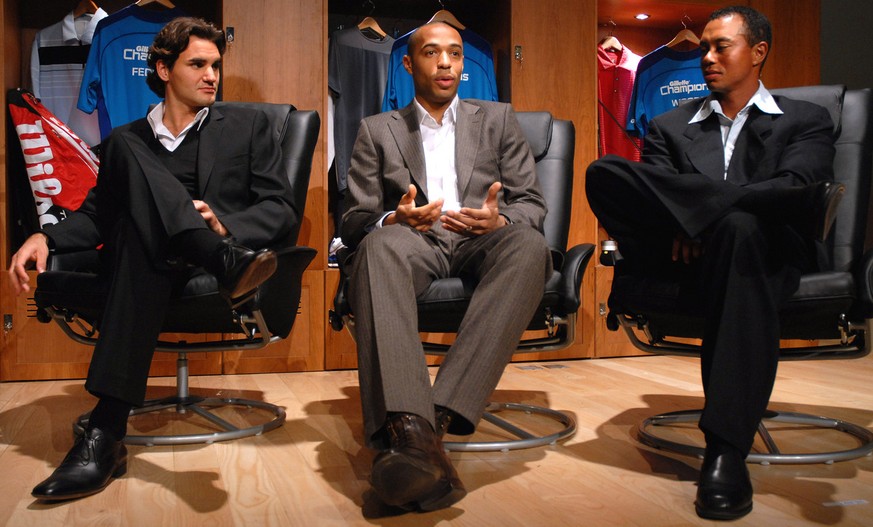French soccer player Thierry Henry, centre, attends a press conference with Swiss tennis player Roger Federer, left, and U.S. golfer Tiger Woods, in Dubai, UAE, Sunday, Feb. 4, 2007. On Sunday, Gillet ...