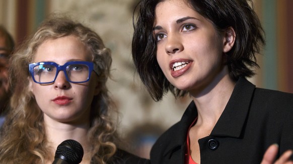 Russian political activists Nadya Tolokonnikova, center, and Maria Alyokhina, left, of the Russian punk band Pussy Riot, join Sen. Ben Cardin, D-Md., the chairman of the Helsinki Commission in seeking ...