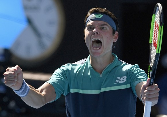 Canada's Milos Raonic celebrates after defeating Germany's Alexander Zverev in their fourth round match at the Australian Open tennis championships in Melbourne, Australia, Monday, Jan. 21, 2019. (AP Photo/Andy Brownbill)