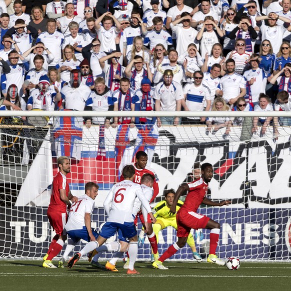 Switzerland&#039;s Johan Djourou, right, in action during the 2018 Fifa World Cup Russia group B qualification soccer match between Switzerland and Faroe Islands at the Torsvollur football stadium in  ...