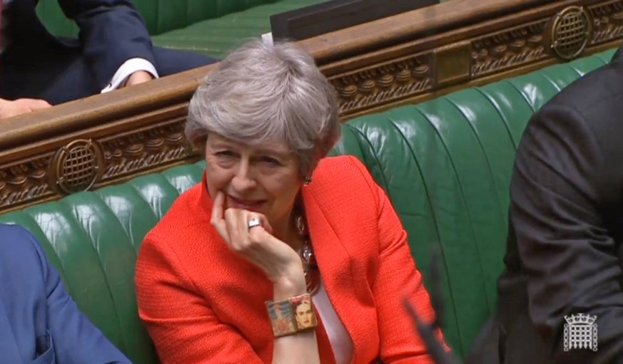 epa07431583 A grab from a handout video made available by the UK Parliamentary Recording Unit shows British Prime Minister Theresa May reacting to Scottish National Party (SNP) MP Ian Blackford pointi ...