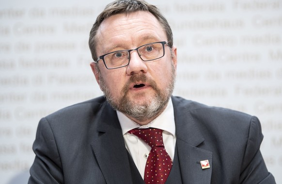 epa08898002 Christian Bock, Director Federal Customs Administration, speaks during a press conference about the travel restrictions, in Bern, Switzerland, 21 December 2020. Switzerland announced trave ...