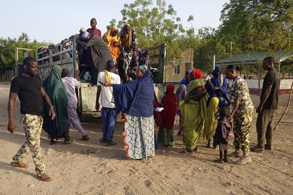 Women and children who were held captive by islamic extremists, and rescued by Nigeria&#039;s army, are seen upon arrival in Maiduguri, Nigeria, Monday, May 20, 2024. Hundreds of hostages mostly child ...