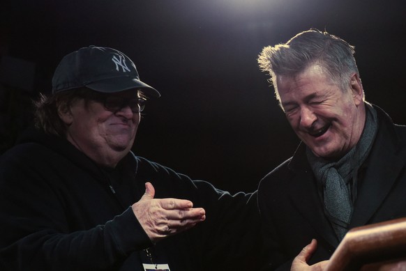 Michael Moore introduces actor Alec Baldwin at a protest against U.S. President-elect Donald Trump outside the Trump International Hotel in New York City, U.S. January 19, 2017. REUTERS/Stephanie Keit ...