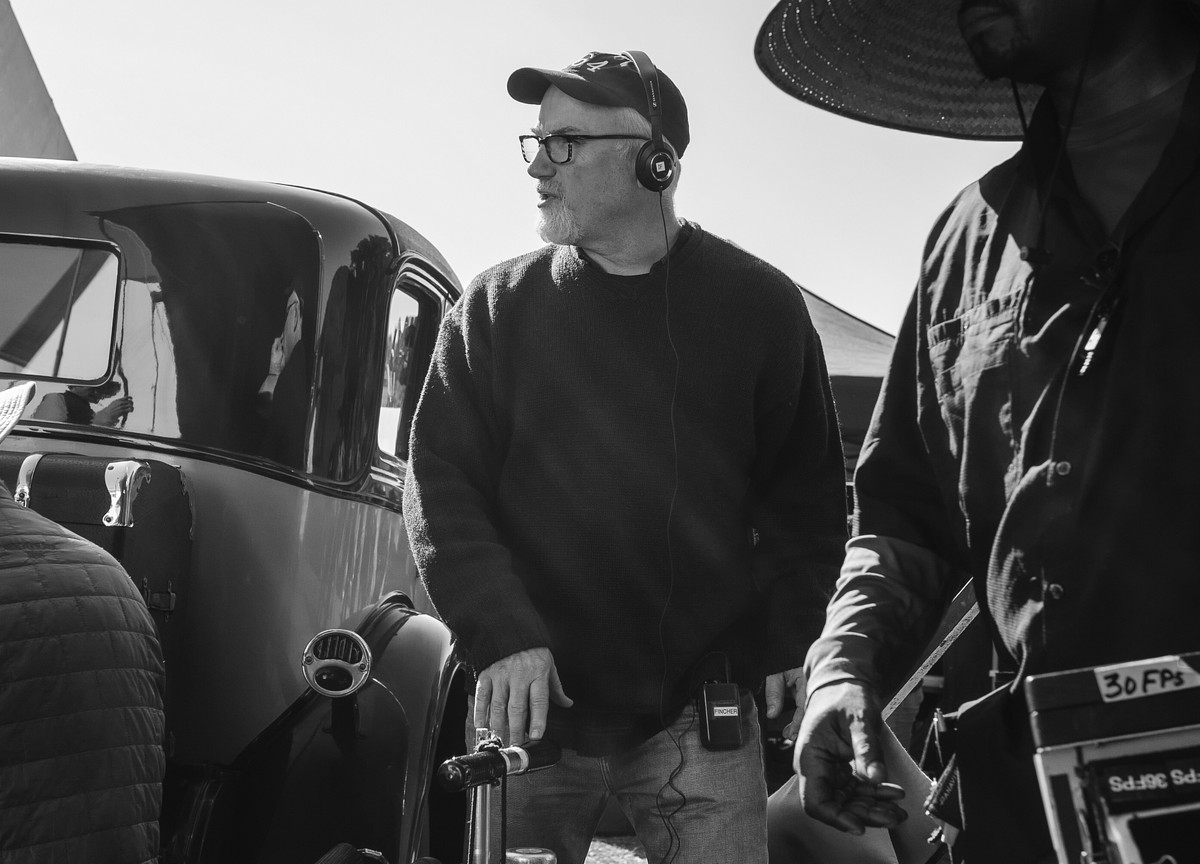 This image released by Netflix shows David Fincher on the set of "Mank." Fincher was nominated for a Golden Globe for best director on Wednesday, Feb. 3, 2021 for his work on the film. (Gise ...