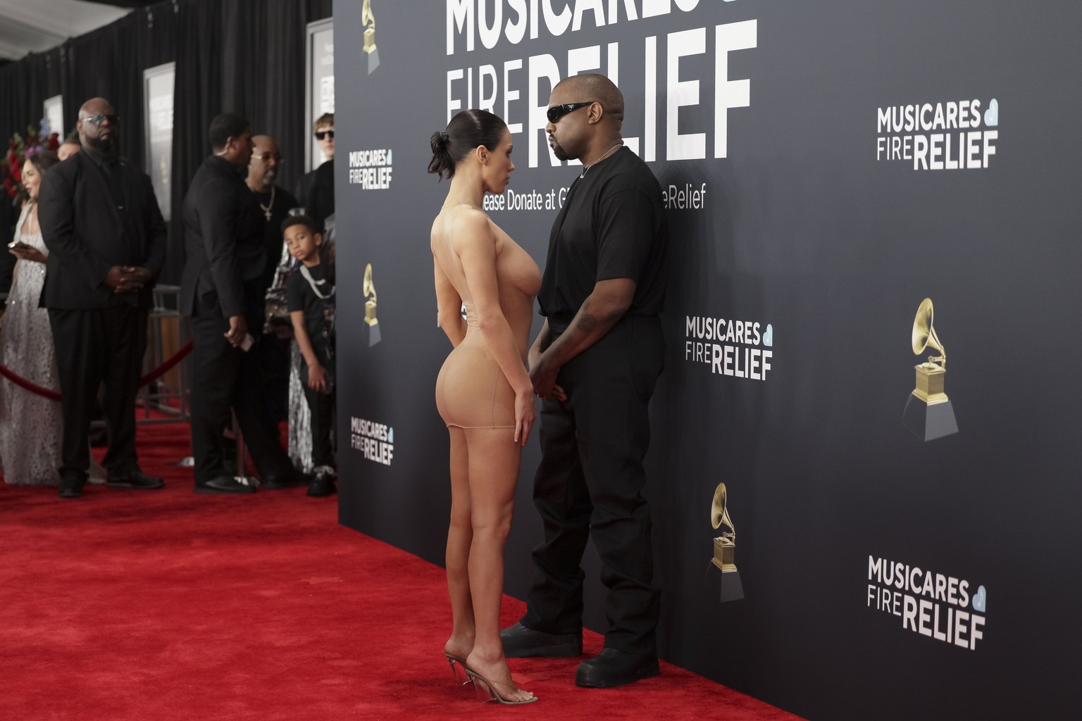 epaselect epa11871310 Kayne West (R) and Bianca Censori on the red carpet for the 67th annual Grammy Awards ceremony at Crypto.com Arena in Los Angeles, California, USA, 02 February 2025. EPA/ALLISON ...