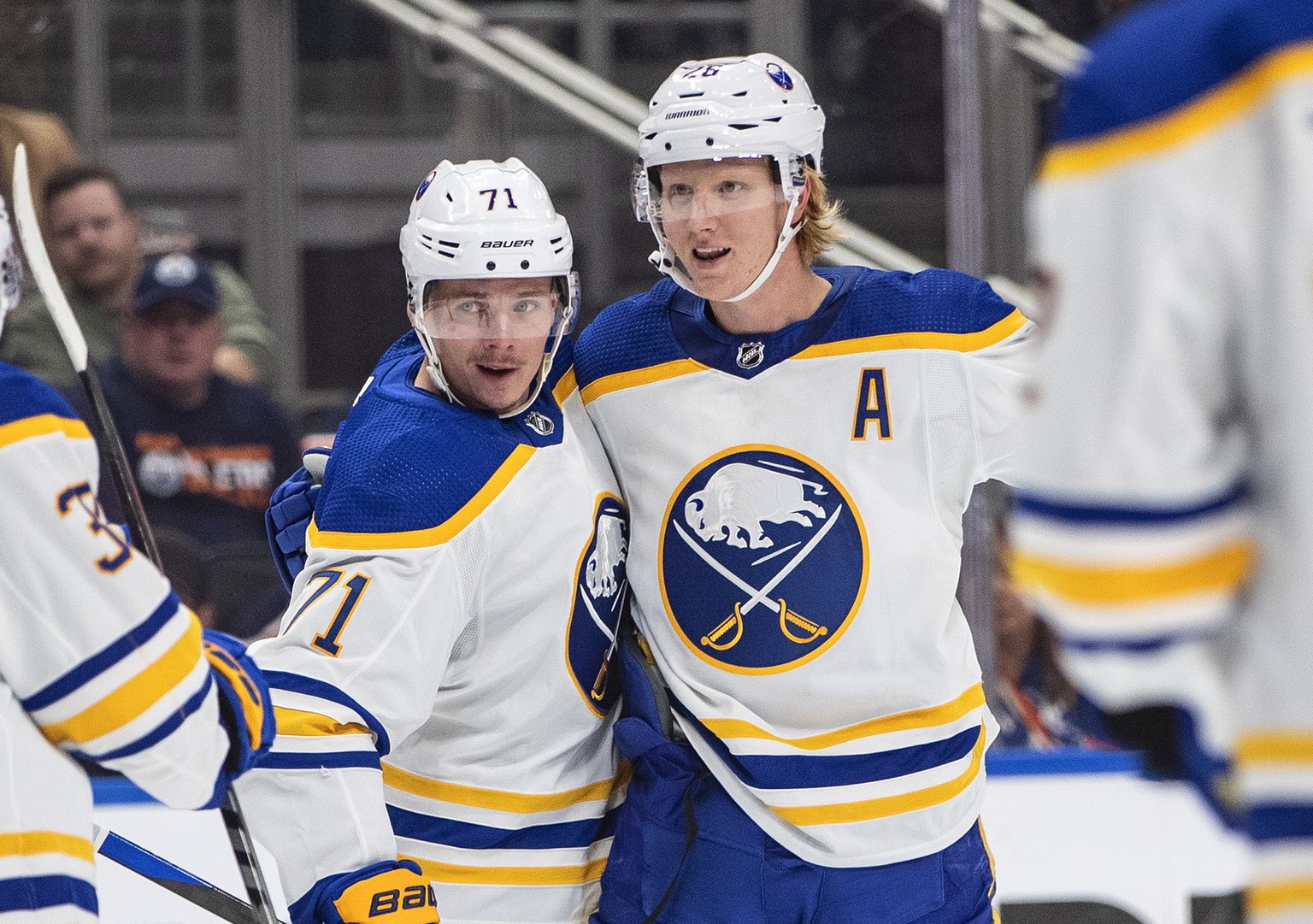 Buffalo Sabres&#039; Casey Mittelstadt (37), Victor Olofsson (71) and Rasmus Dahlin (26) celebrate a goal against the Edmonton Oilers during the first period of an NHL hockey game Tuesday, Oct. 18, 20 ...