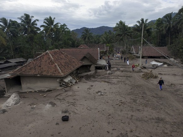 epa09625037 An aerial photo shows general view of an area affected by the eruption of Mount Semeru at Sumber Wuluh village in Lumajang, East Java, Indonesia, 06 December 2021. The volcano erupted on 0 ...