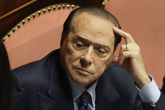 FILE - Forza Italia party leader Silvio Berlusconi in the Senate, in Rome, on October 2.  February 26, 2022. Former Prime Minister Silvio Berlusconi was found not guilty of witness tampering in the ...