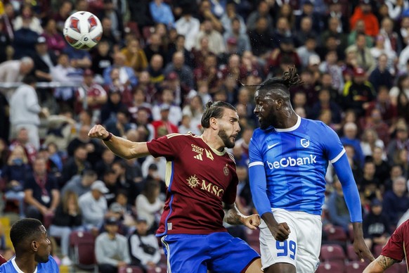 Genk&amp;#039;s forward Toluwalase Arokodare, right, scores the 0:1 past Servette&amp;#039;s defender Yoan Severin, left, during the UEFA Champions League Second qualifying round first leg soccer matc ...