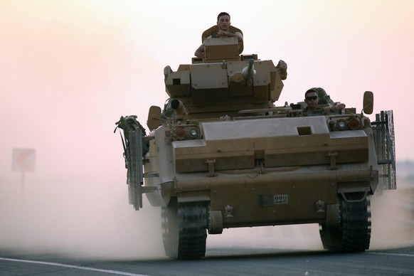 epa07908168 Turkish soldiers with armored vehicles and tanks during a military operation in Kurdish areas of northern Syria, near the Syrian border, in Akcakale, Sanliurfa, Turkey 09 October 2019. Tur ...