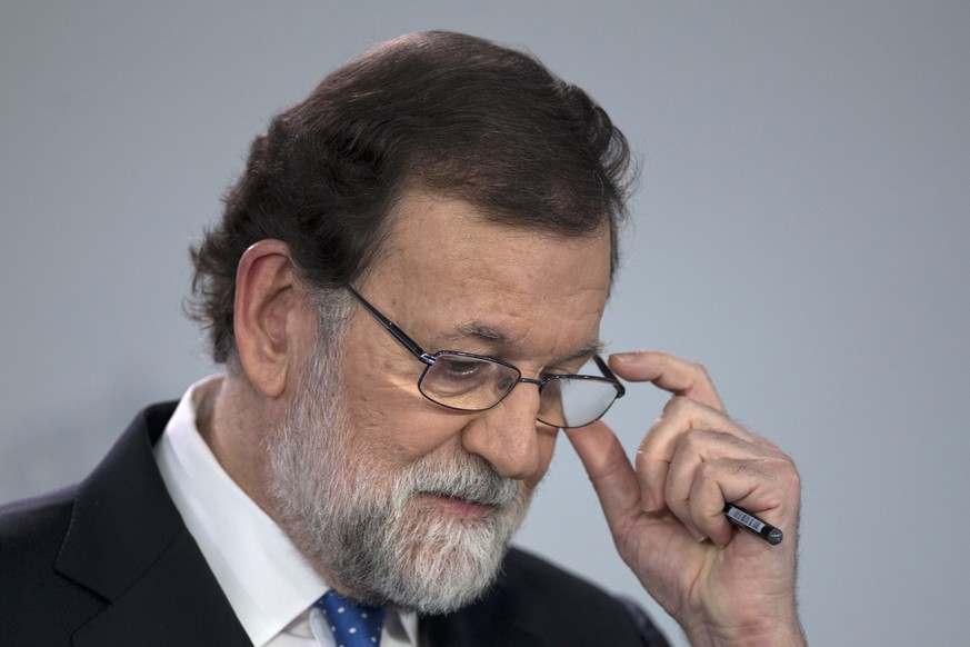 Spain&#039;s Prime Minister Mariano Rajoy pauses during a news conference in Madrid, Spain, Friday, Dec. 22, 2017. Catalonia&#039;s secessionist parties won enough votes Thursday to regain a slim majo ...