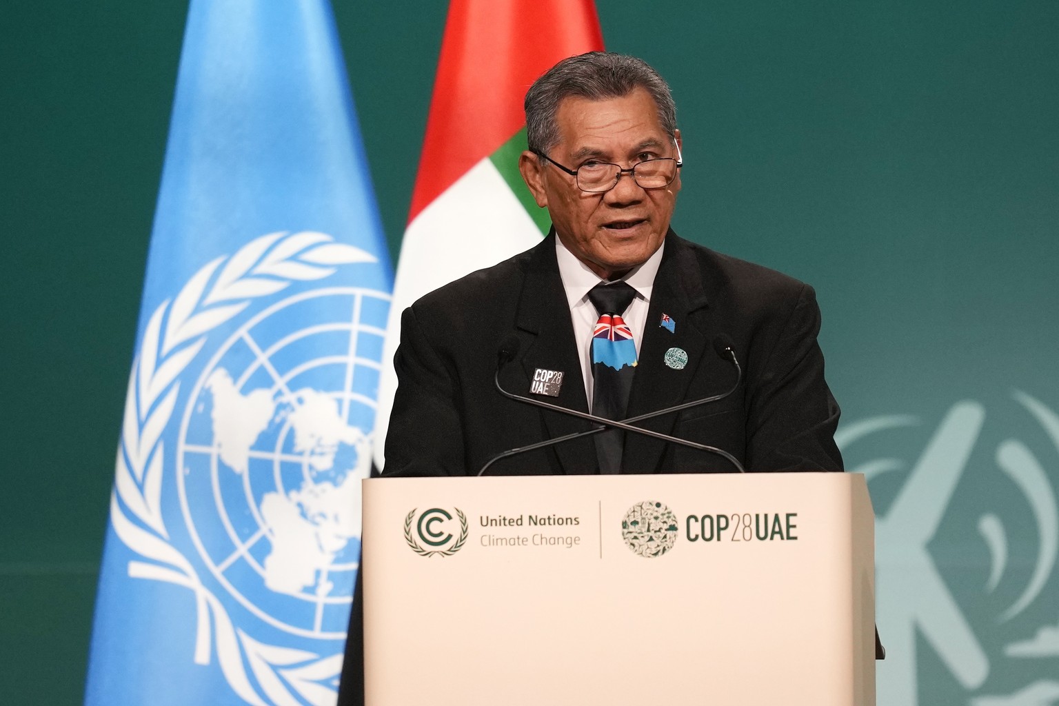Tuvalu Prime Minister Kausea Natano speaks during a plenary session at the COP28 U.N. Climate Summit, Saturday, Dec. 2, 2023, in Dubai, United Arab Emirates. (AP Photo/Rafiq Maqbool)