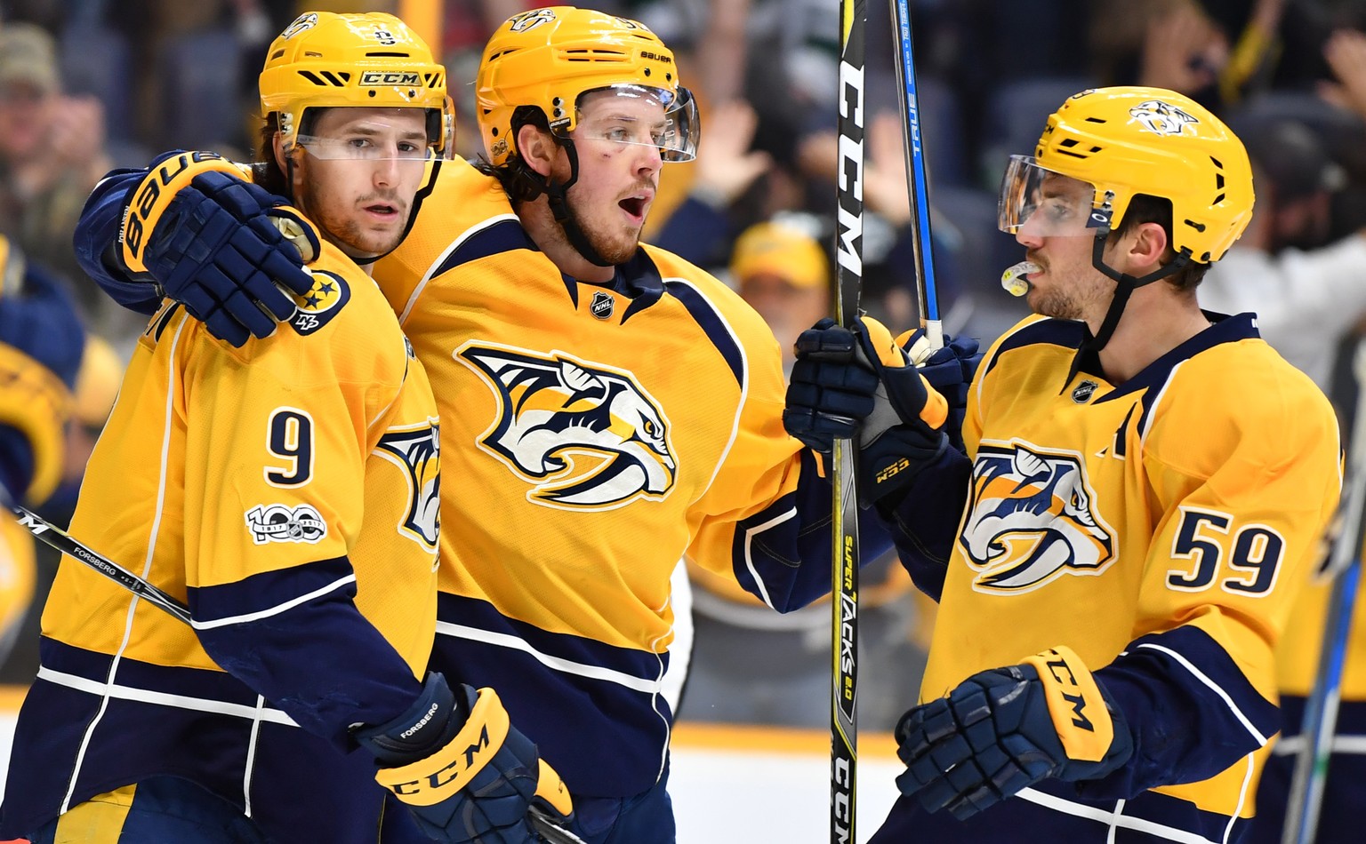 Apr 1, 2017; Nashville, TN, USA; Nashville Predators left wing Filip Forsberg (9) celebrates with center Ryan Johansen (92) and defenseman Roman Josi (59) after a goal during the second period against ...