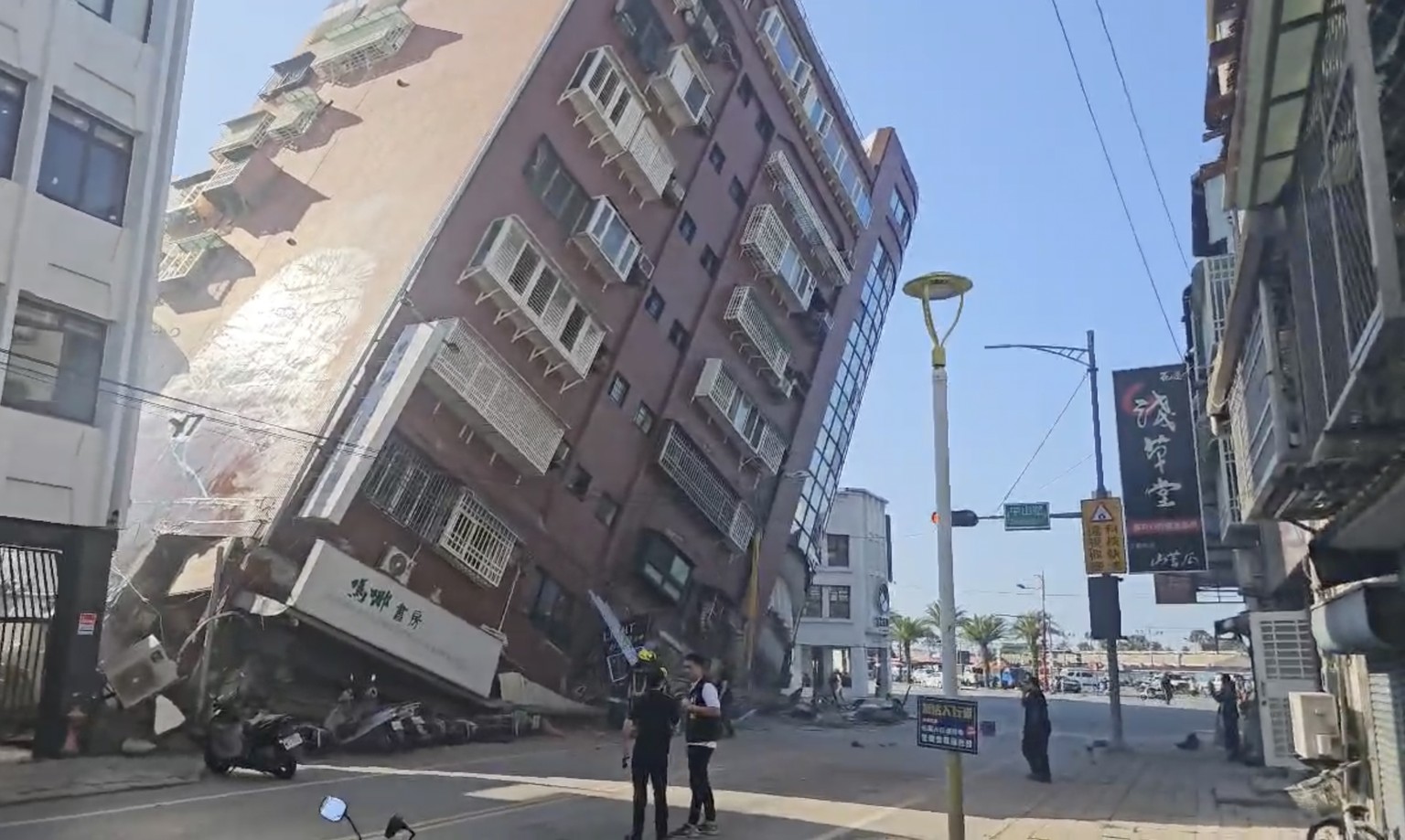 In this image taken from a video footage run by TVBS, a partially collapsed building is seen in Hualien, eastern Taiwan on Wednesday, April 3, 2024. A powerful earthquake rocked the entire island of T ...