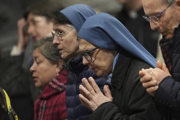 Faithful and nuns gather at St. John Lateran Basilica in Rome Sunday, Feb. 23, 2025, to pray for Pope Francis who was admitted over a week ago at Rome&#039;s Agostino Gemelli Polyclinic and is in crit ...