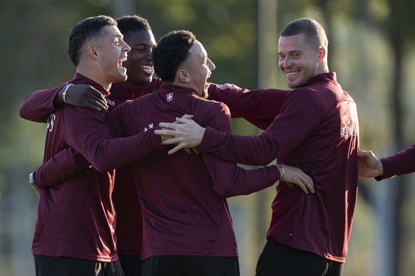KEYPIX - Switzerland's players Granit Xhaka, Breel Embolo, Ruben Vargas, and Nico Elvedi, from left, react during a training session one day prior to the FIFA World Cup 26 UEFA Qualifiers Group B ...