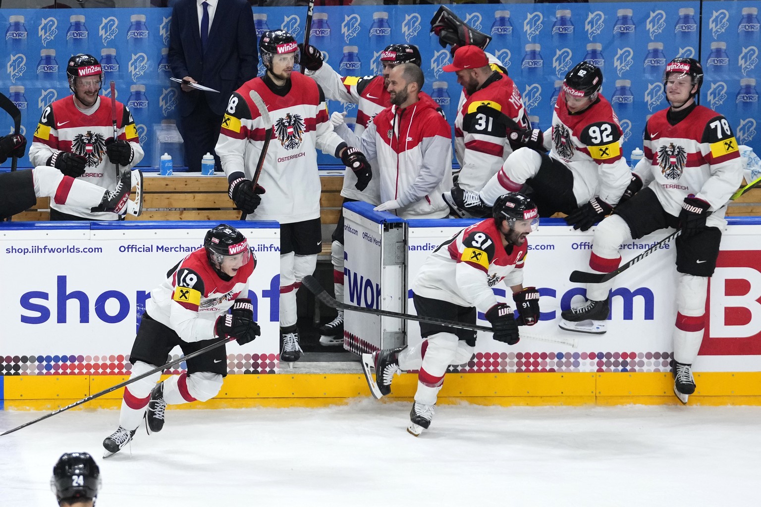 Austria&#039;s players celebrate after the preliminary round match between Norway and Austria at the Ice Hockey World Championships in Prague, Czech Republic, Sunday, May 19, 2024. (AP Photo/Petr Davi ...