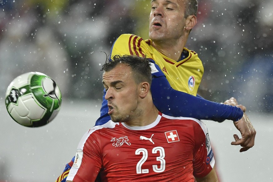 Swiss forward Xherdan Shaqiri, left, fights for the ball against Andorra&#039;s Ildefons Lima during the 2018 Fifa World Cup Russia group B qualification soccer match between Switzerland and Andorra a ...