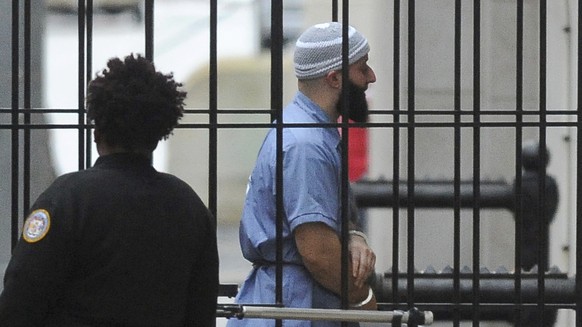 FILE - In this Feb. 3, 2016 file photo, Adnan Syed enters Courthouse East prior to a hearing in Baltimore. Baltimore prosecutors and attorneys for Syed, a Maryland man whose murder conviction was chro ...