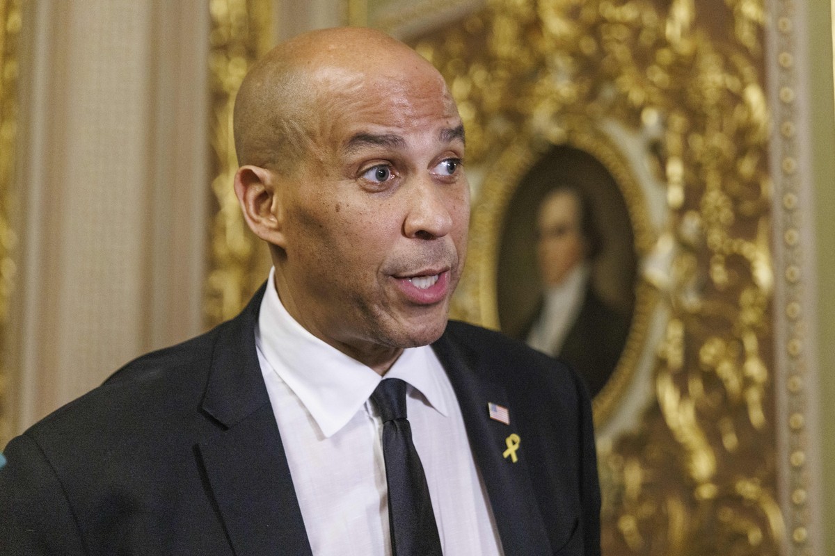 epa12004157 US Senator Cory Booker (Democrat of New Jersey) speaks to the media off the Senate floor after completing a record-breaking 25-hour, 5-minute filibuster in opposition to US President Trump ...