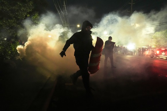 Anti-ICE protesters disperse during clashes with law enforcement officers outside the Delaney Hall detention center on Saturday, May 30, 2026, in Newark, N.J. (AP Photo/Angelina Katsanis)
Immigration  ...