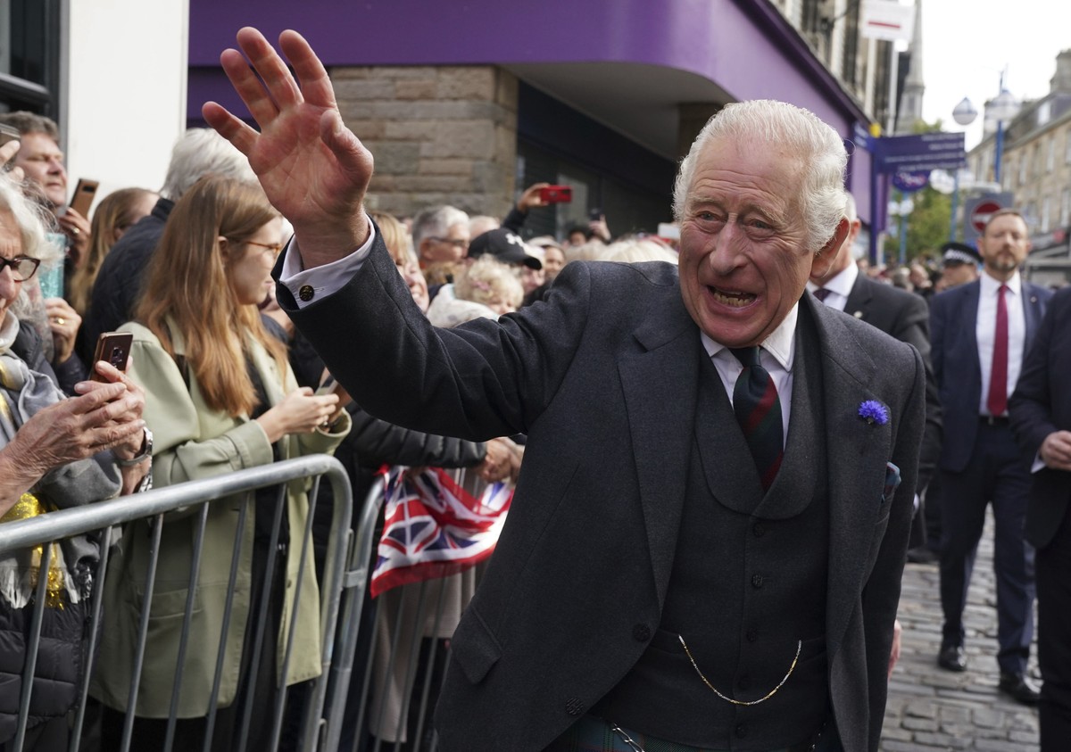 Britain's King Charles III meets the public on a walk after attending an official council meeting at the City Chambers in Dunfermline, Fife, to formally mark the conferral of city status on the f ...