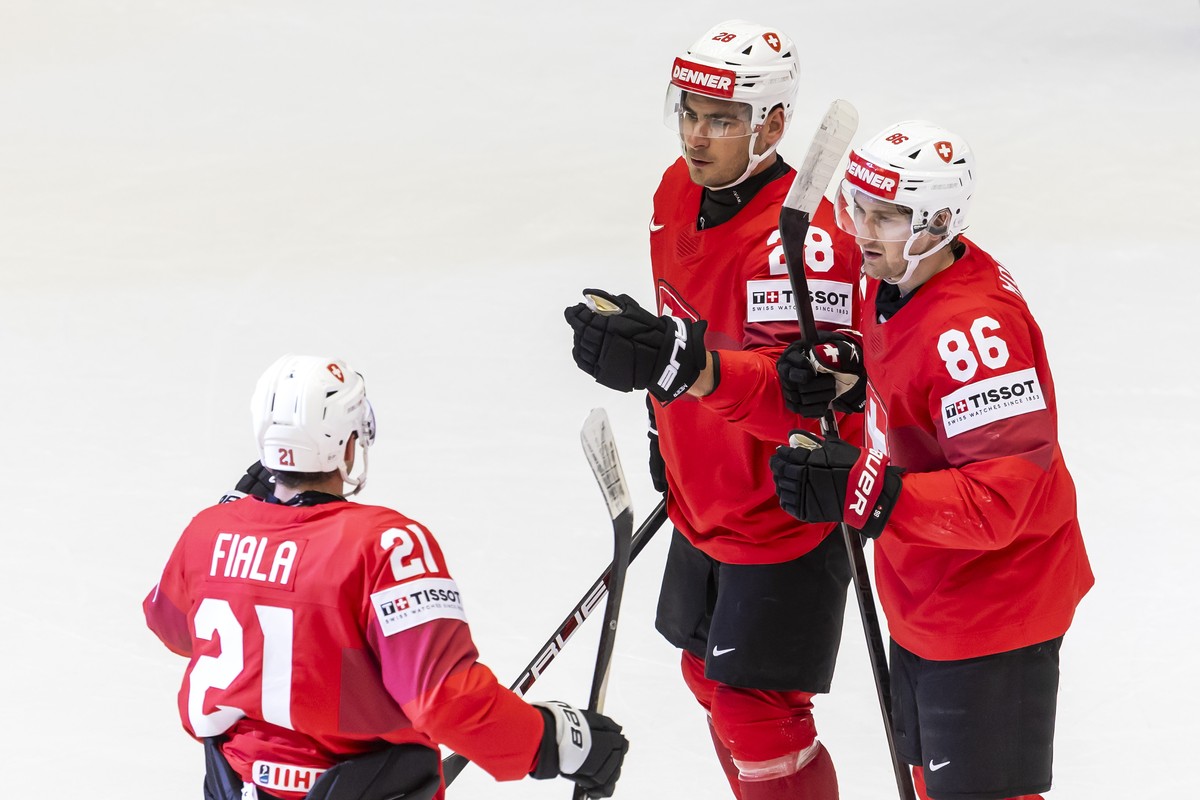 epa12125943 Switzerland's forward Timo Meier #28 celebrates his goal with his teammates Switzerland's forward Kevin Fiala #21 and Switzerland's defender Janis Jerome Moser #86, after sc ...