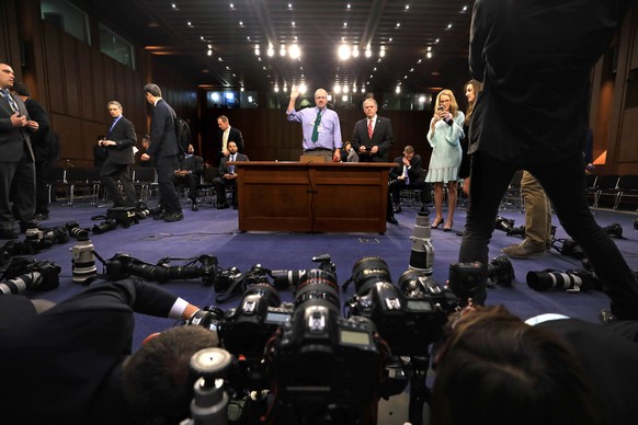 epa06016599 Photographers set up and focus cameras placed on the ground and prepared for the arrival of former FBI Director James Comey, who is slated to deliver a much-anticipated testimony before th ...