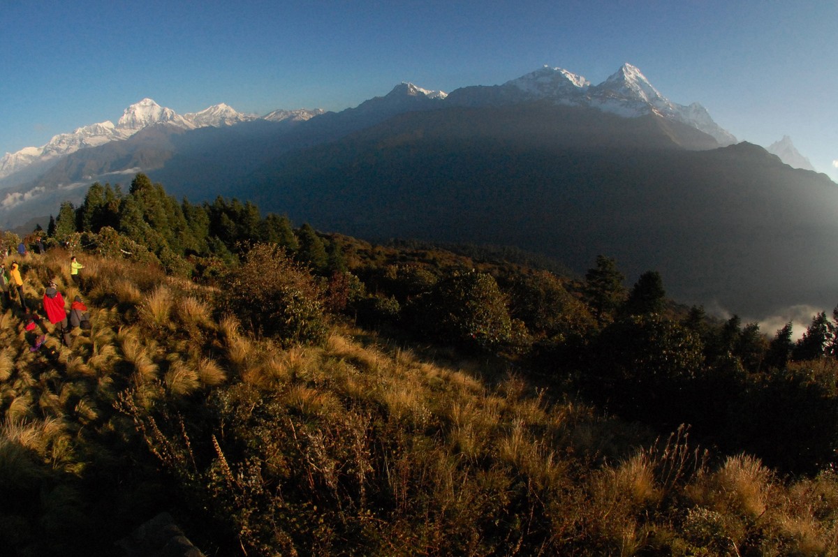 FILE - In this Friday, Oct. 24, 2014 file photo, trekkers watch the sun rise over the Annapurna Range, right, in central Nepal, as viewed from Poon Hill, above the village of Ghorepani. A Finnish clim ...