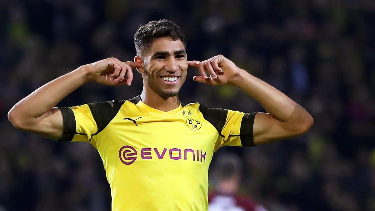epa07049614 Dortmund's Jadon Sancho (R) celebrates with his teammate Achraf Hakimi (L) after scoring the 6-0 lead during the German Bundesliga soccer match between Borussia Dortmund and FC Nuernb ...