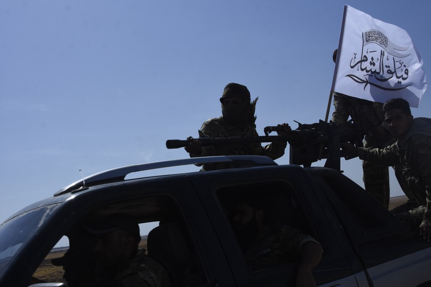 Turkey-backed FSA fighters are heading toward Syrian town of Tal Abyad from Turkish border town of Akcakale, Turkey, Thursday, Oct. 10, 2019. Turkish President Recep Tayyip Erdogan says that there hav ...