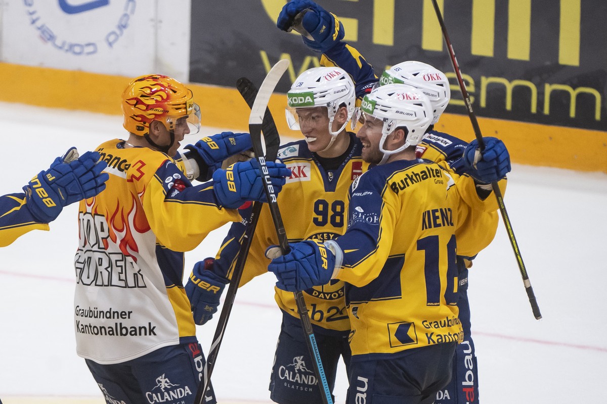 Fron left, Davos's player Perttu Lindgren and Davos's player Benjamin Baumgarten, celebrate 1-2 gool, during the preliminary round game of National League A (NLA) Swiss Championship 2019/20  ...