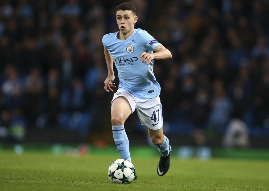 Manchester City&#039;s Phil Foden runs with the ball during the Champions League group F soccer match between Manchester City and Feyenoord, at the Etihad Stadium in Manchester, England, Tuesday, Nov. ...