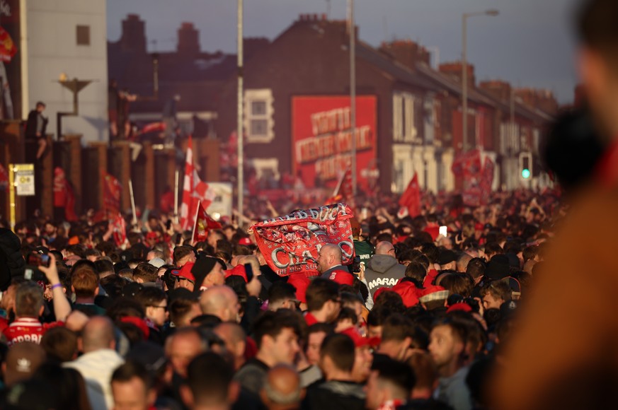epa12059421 Supporters of Liverpool celebrate outside Anfield after Liverpool won the 2024/2025 Premier League title by beating Tottenham Hotspur 5-1 at Anfield in Liverpool, Britain, 27 April 2025. E ...