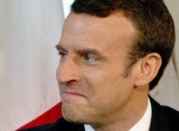 epa05989023 US President Donald J. Trump shakes hands with French President Emmanuel Macron (R) during a meeting on the sidelines of the NATO (North Atlantic Treaty Organization) summit, at the US amb ...