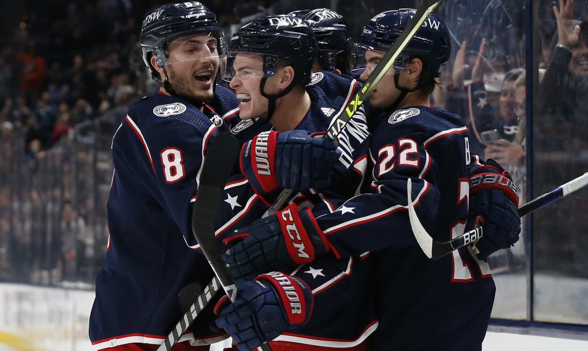Columbus Blue Jackets' Gregory Hofmann, center, celebrates his goal against the Dallas Stars during the second period of an NHL hockey game Monday, Oct. 25, 2021, in Columbus, Ohio. (AP Photo/Jay ...