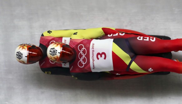 Tobias Arlt and Tobias Wendl of Germany takes a curve during the men&#039;s doubles luge final at the 2018 Winter Olympics in Pyeongchang, South Korea, Wednesday, Feb. 14, 2018. (AP Photo/Michael Sohn ...