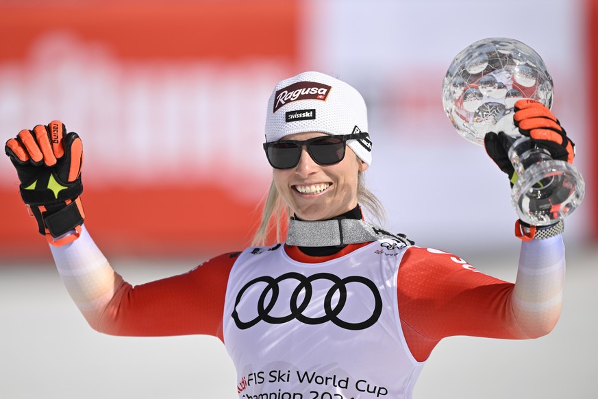 Lara Gut-Behrami of Switzerland celebrates with the women&#039;s slalom overall leader crystal globe trophy in the finish area during the women&#039;s giant slalom race at the FIS Alpine Skiing World  ...