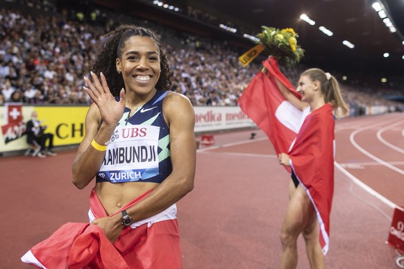 epa09458113 Mujinga Kambundji, left, and Ajla Del Ponte of Switzerland react after their 100m Women during the Weltklasse IAAF Diamond League international athletics meeting at the Letzigrund stadium  ...