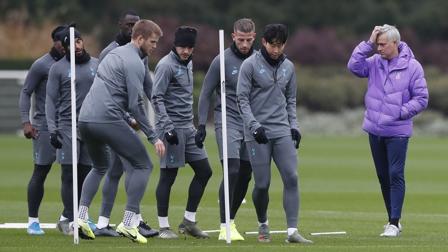 Tottenham's manager Jose Mourinho, right, watches his players, including Son Heung-min, second right, during a training session for their upcoming Champions League Group B soccer match against Ol ...