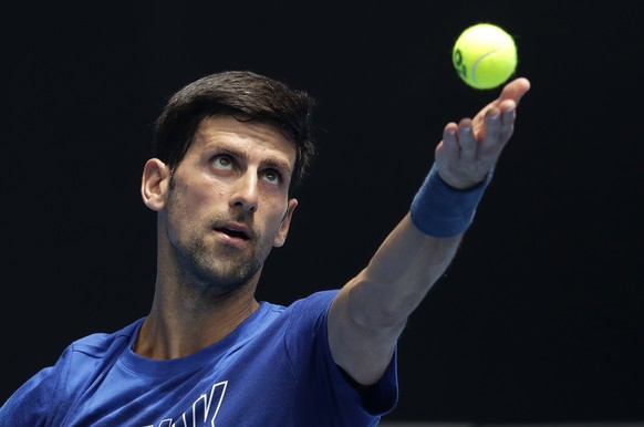 Serbia&#039;s Novak Djokovic serves during a practice session ahead of the Australian Open tennis championships in Melbourne, Australia, Saturday, Jan. 12, 2019. (AP Photo/Kin Cheung)